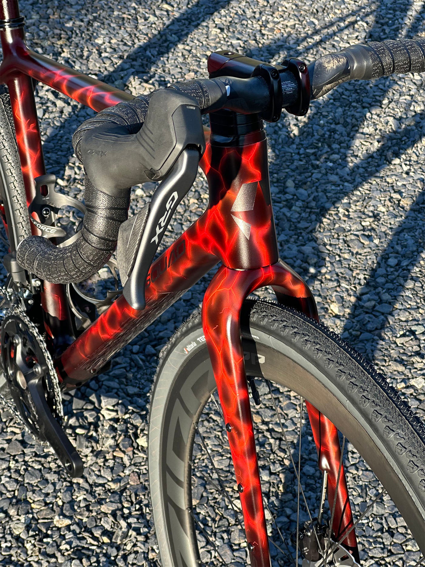 Hand-painted lava effect custom gravel bike based on AI concept art, Squad Root frame by Squad Cycles